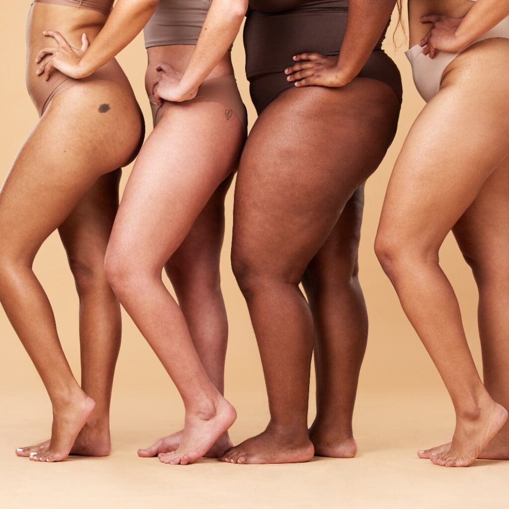 Diversity women, legs and different body and skin of group together for inclusion, beauty and power. Underwear model people on beige background with cellulite, pride and motivation for self love